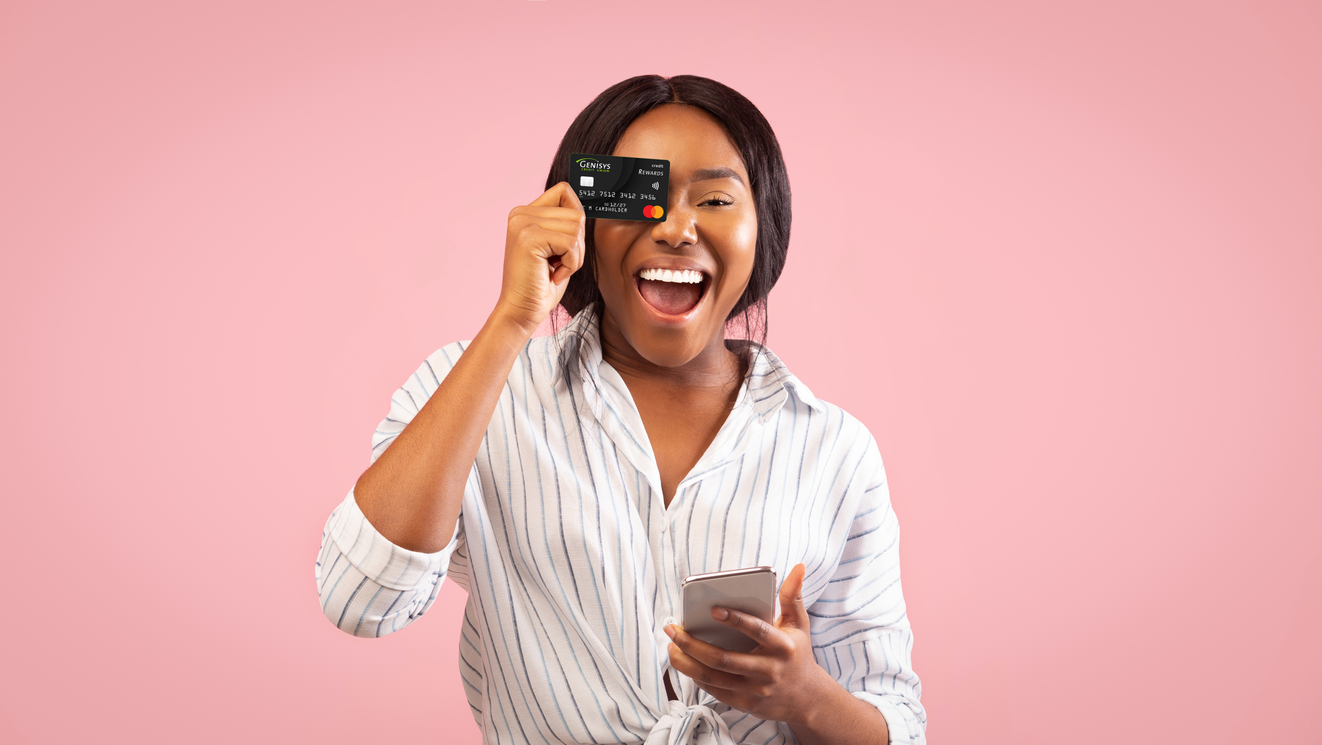 Girl smiling and holding credit card